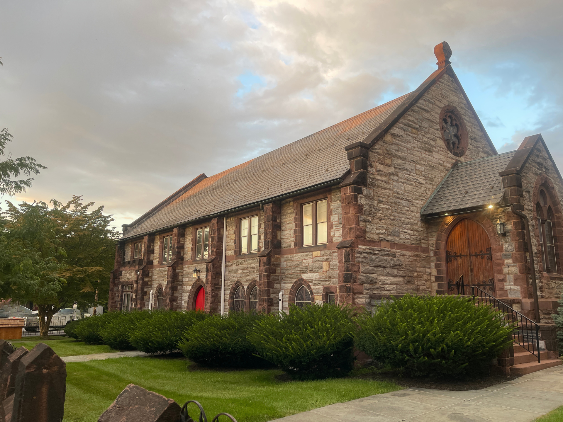 exterior stone parish hall at twilight