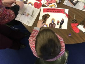 child cutting out paper