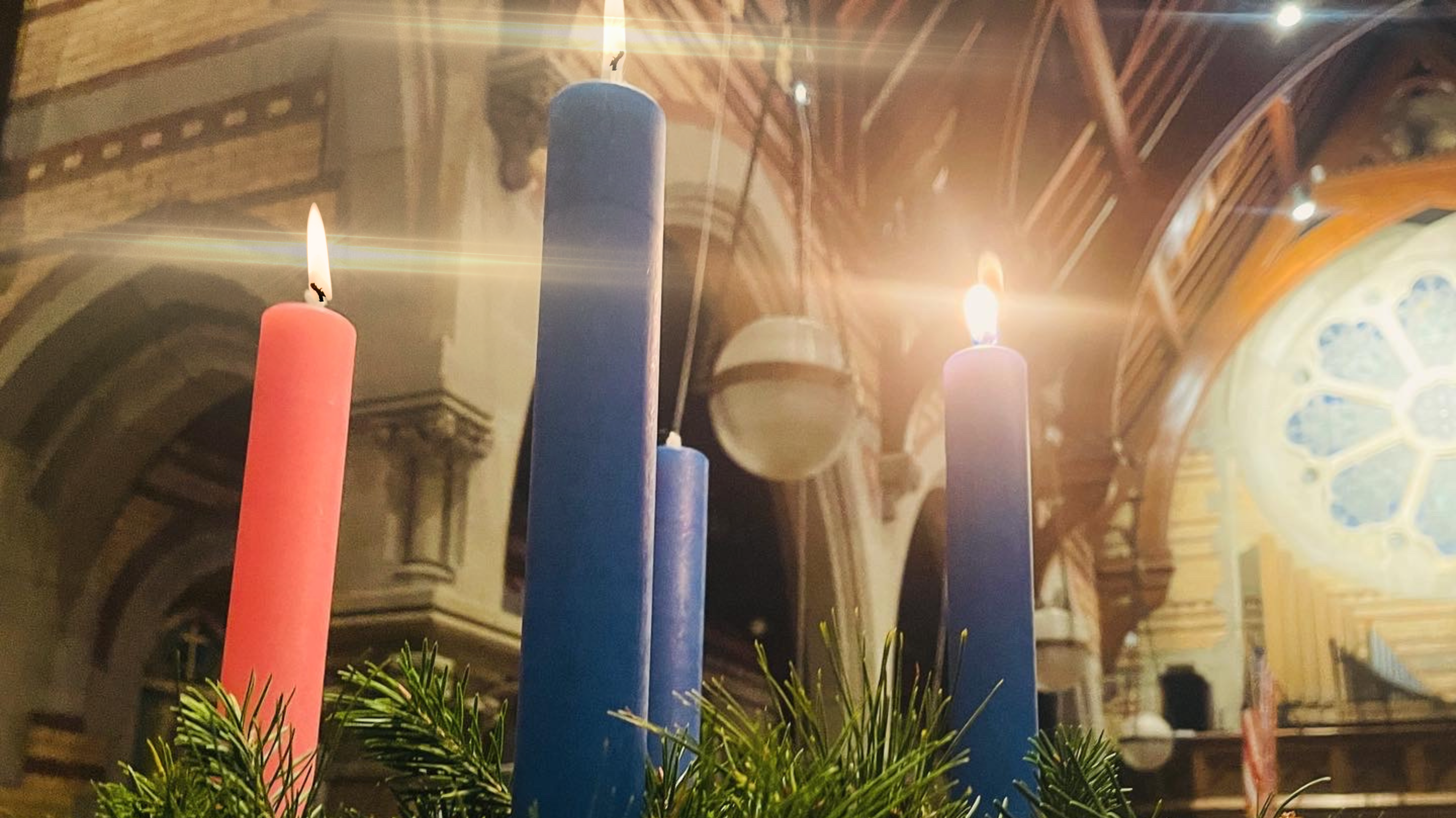 advent wreath with three lit candles
